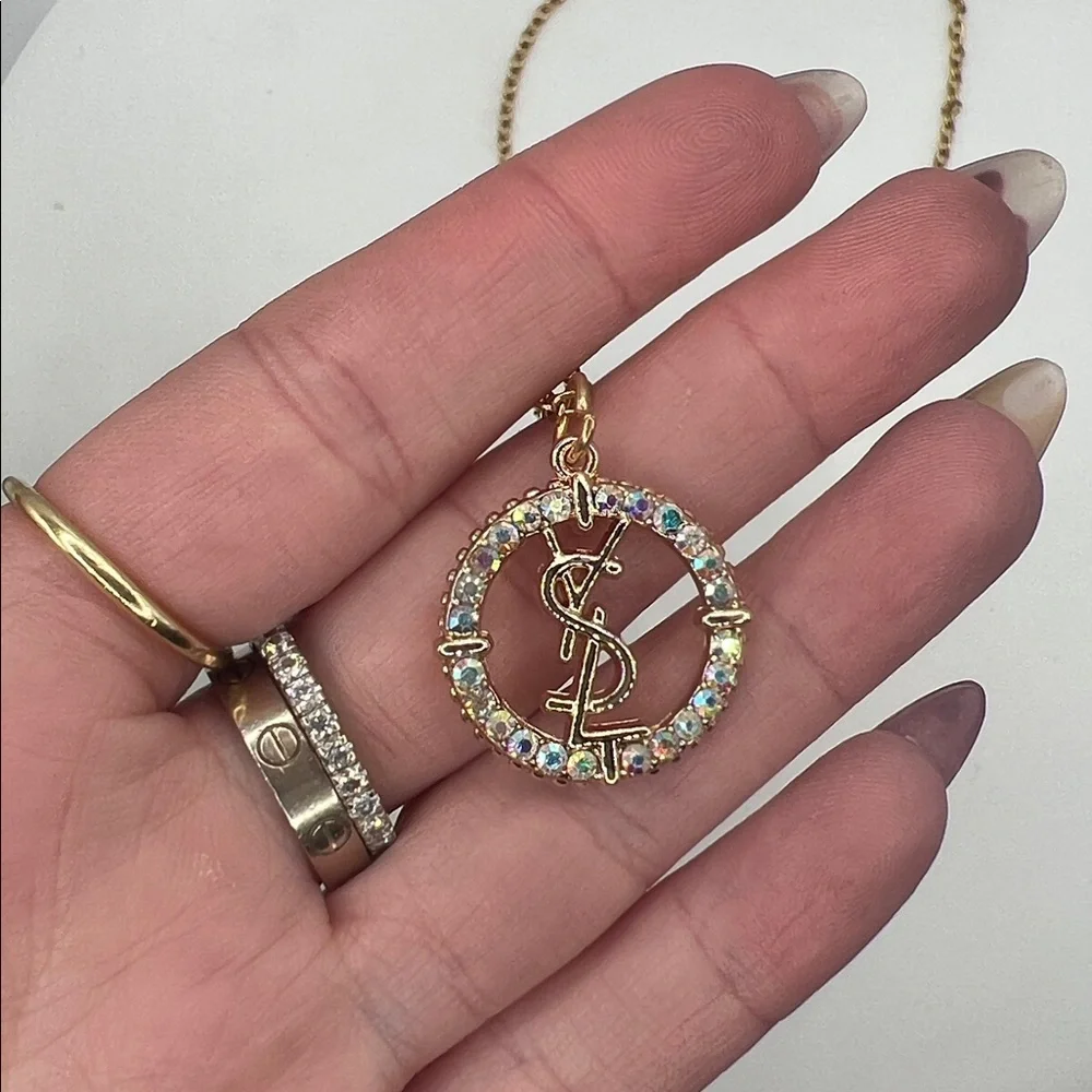 868. Elegant Gold YSL Pendant on 18” gold plated chain. - Picture 3 of 8